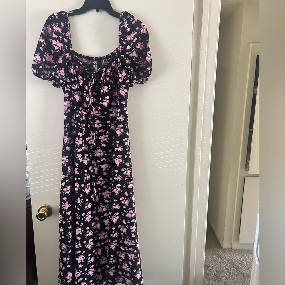 SHEIN Black Maxi Dress with Pink Floral Design has a mid-thigh slit.